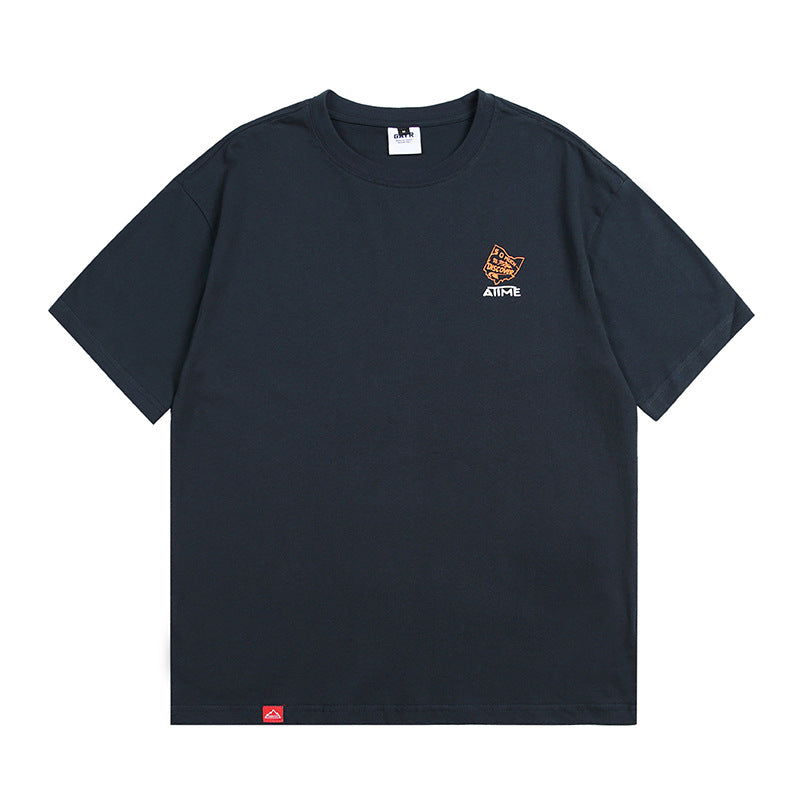 Navy blue unisex loose printed short sleeve T-shirt lifestyle shot – Y2K streetwear style | TeenStylo