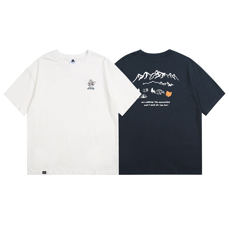 Navy blue unisex loose printed tee worn in a lifestyle setting, Y2K streetwear aesthetic | TeenStylo