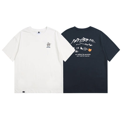 Navy blue unisex loose printed tee worn in a lifestyle setting, Y2K streetwear aesthetic | TeenStylo