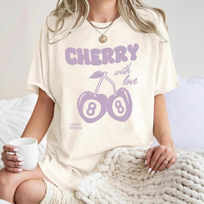 Close-up detail of embroidered red cherry print on women's short sleeve t-shirt | TeenStylo