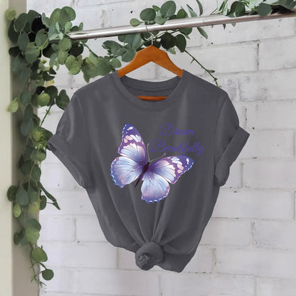 Woman wearing bamboo green butterfly print short sleeve T-shirt in urban streetwear style | TeenStylo