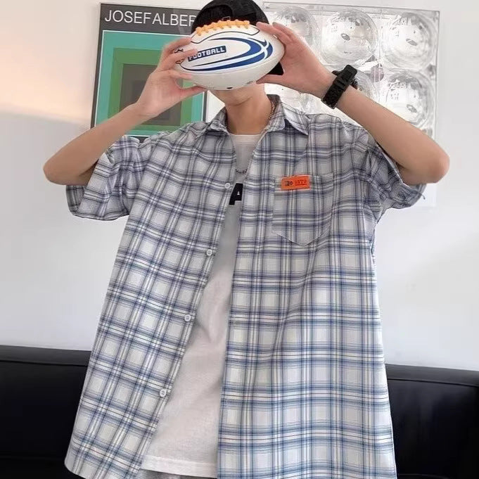 Man wearing yellow checkered short sleeve shirt in a casual streetwear style outfit | TeenStylo