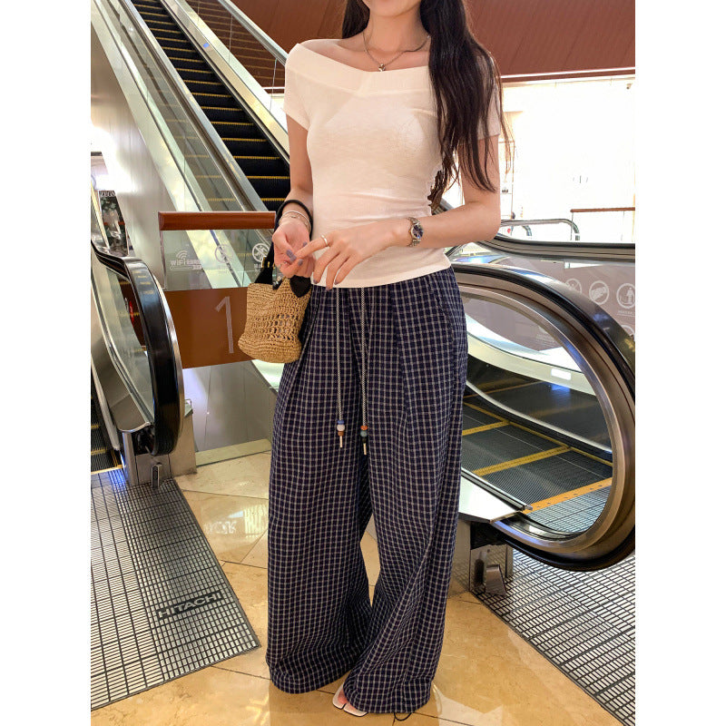 Olive green one-shoulder short sleeve tee styled in a Y2K streetwear look, worn casually outdoors | TeenStylo
