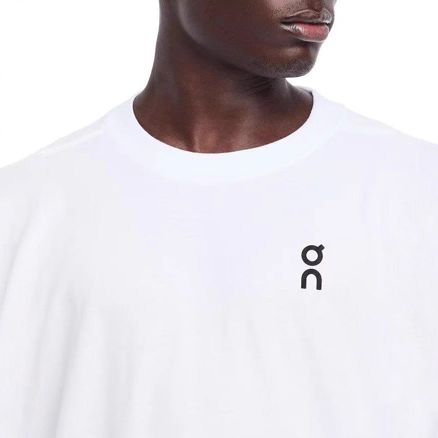 White unisex On Club T graphic cotton tee lifestyle shot, Y2K streetwear style for men and women | TeenStylo