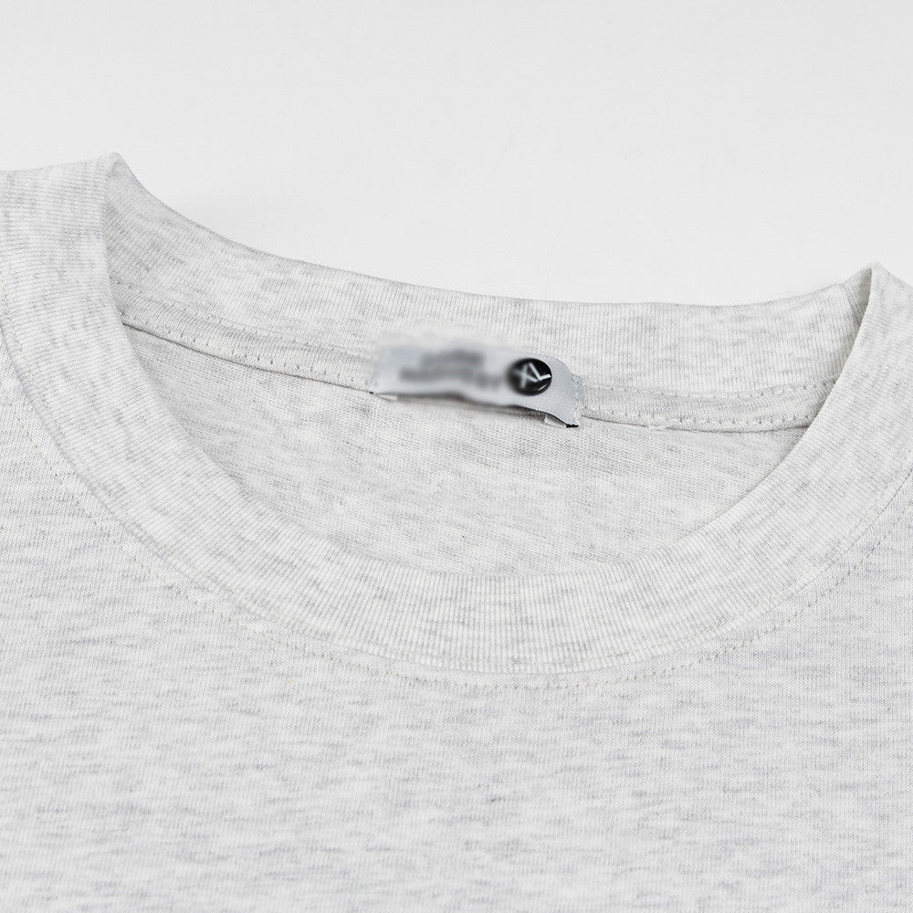 Close-up detail of snowflake gray cartoon sticker print t-shirt streetwear graphic tee for men | TeenStylo