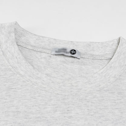 Close-up detail of snowflake gray cartoon sticker print t-shirt streetwear graphic tee for men | TeenStylo