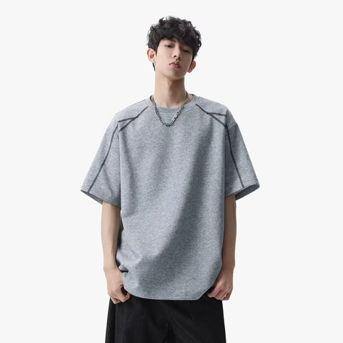 Black men's loose short sleeve streetwear T-shirt front view – youth street style fashion at TeenStylo