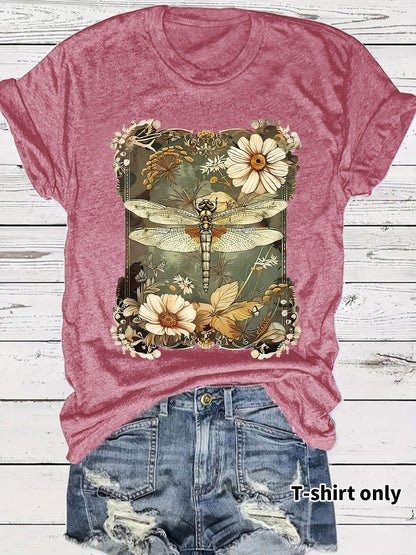 Woman wearing dark red dragonfly print short sleeve t-shirt in urban lifestyle setting | TeenStylo