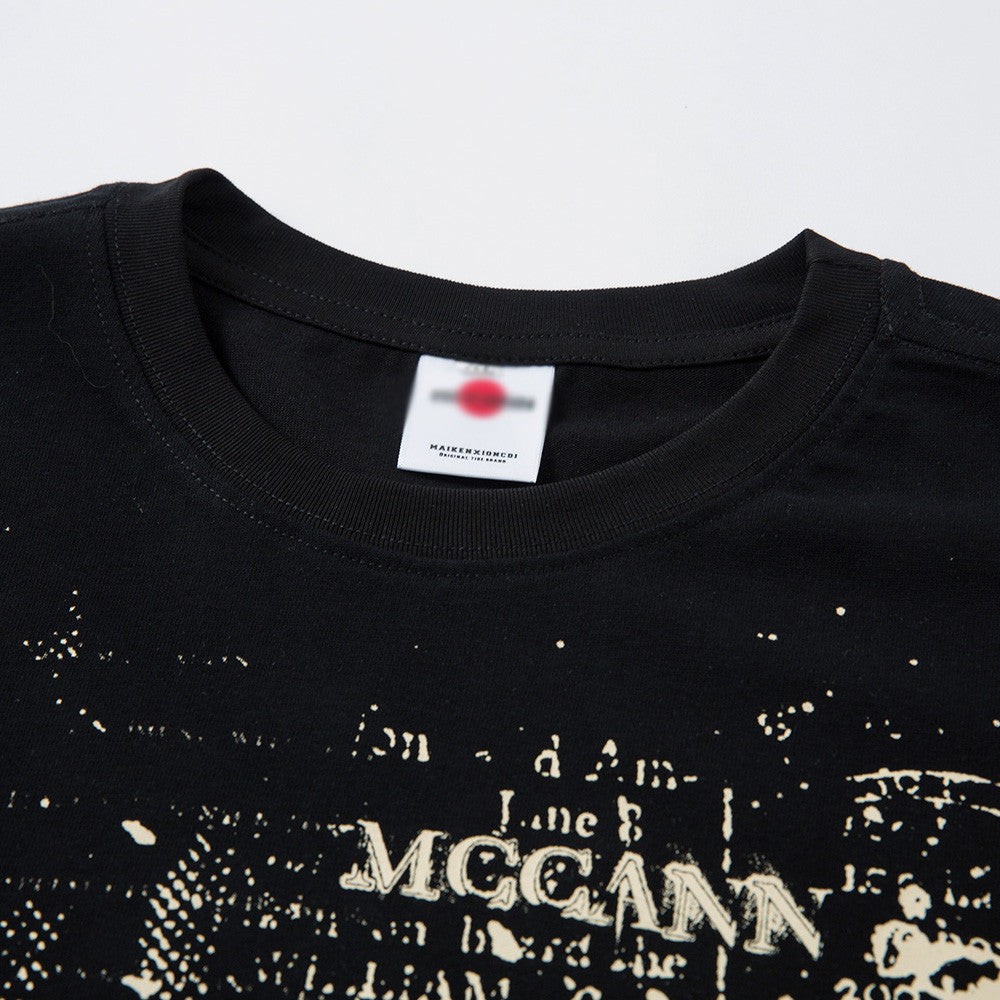 White graffiti letter t-shirt with ink splatter detail closeup, streetwear style for teen boys | TeenStylo