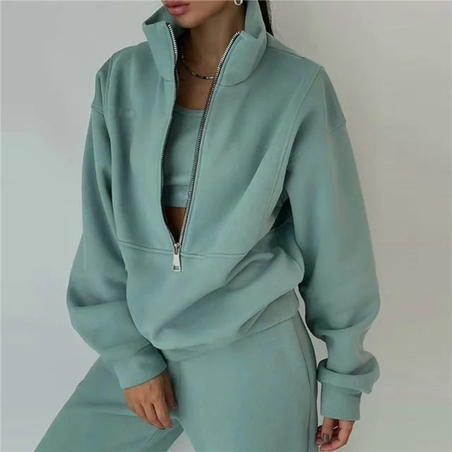 Dark green hooded zipper tracksuit 2-piece set lifestyle shot for women streetwear at TeenStylo