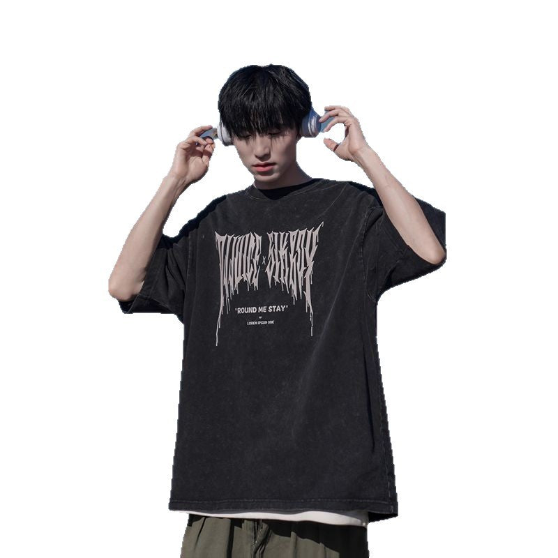 Plain black men's short sleeve streetwear t-shirt lifestyle shot - TeenStylo