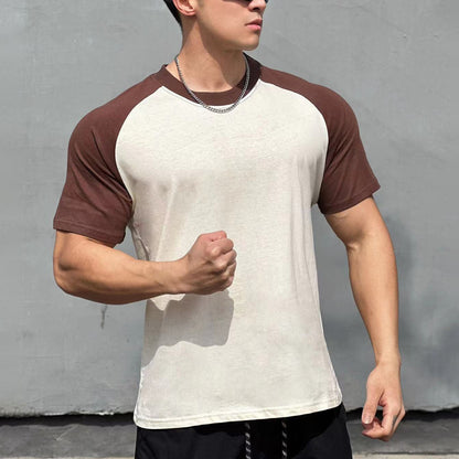 Men's navy blue color-blocked raglan sleeve T-shirt back view, streetwear style - TeenStylo