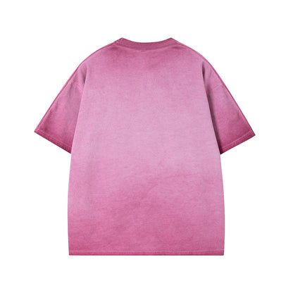 Pink graphic tee close-up detail showing letter print design on men's streetwear short sleeve T-shirt | TeenStylo