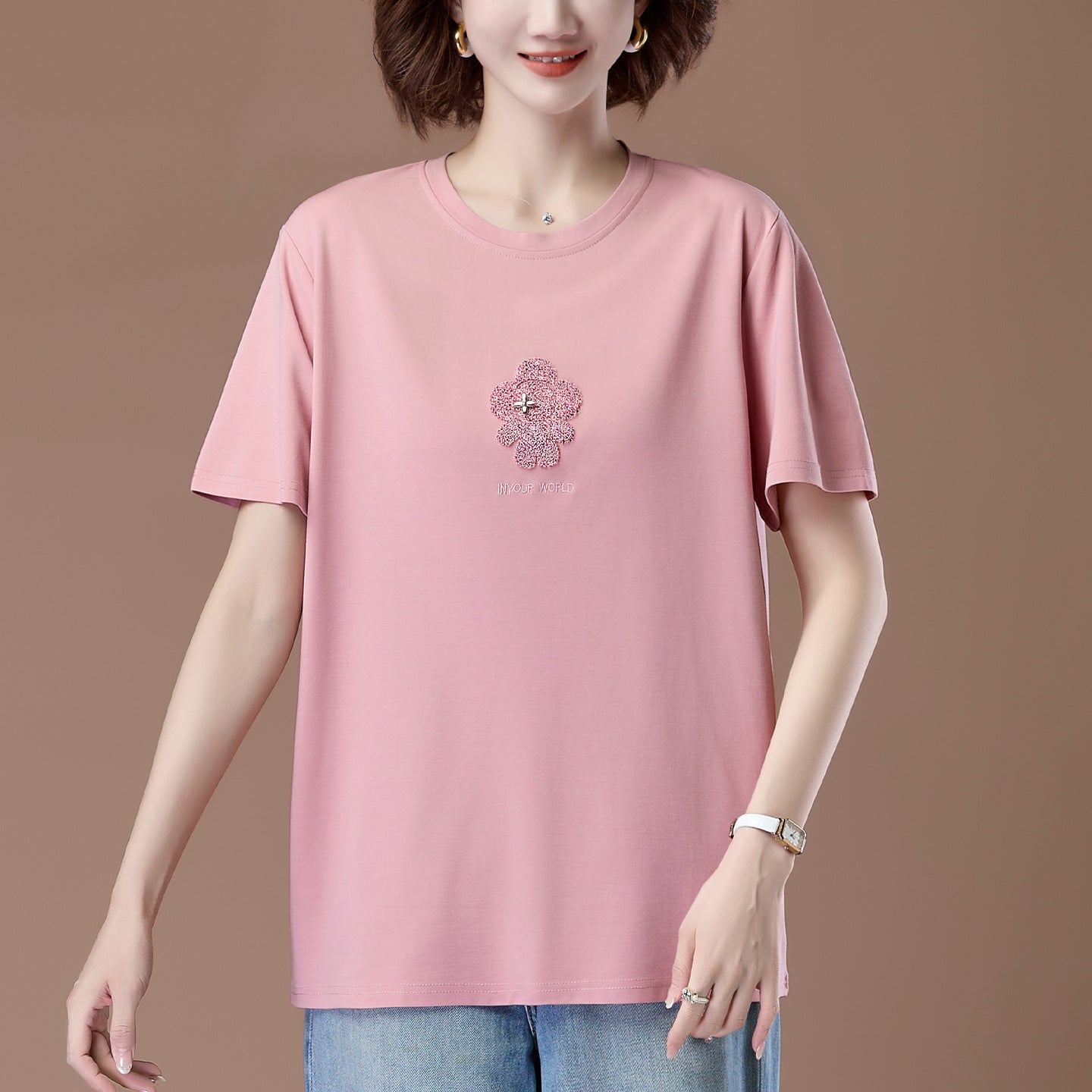 Pink embroidered short sleeve unisex t-shirt lifestyle shot - Y2K streetwear style at TeenStylo