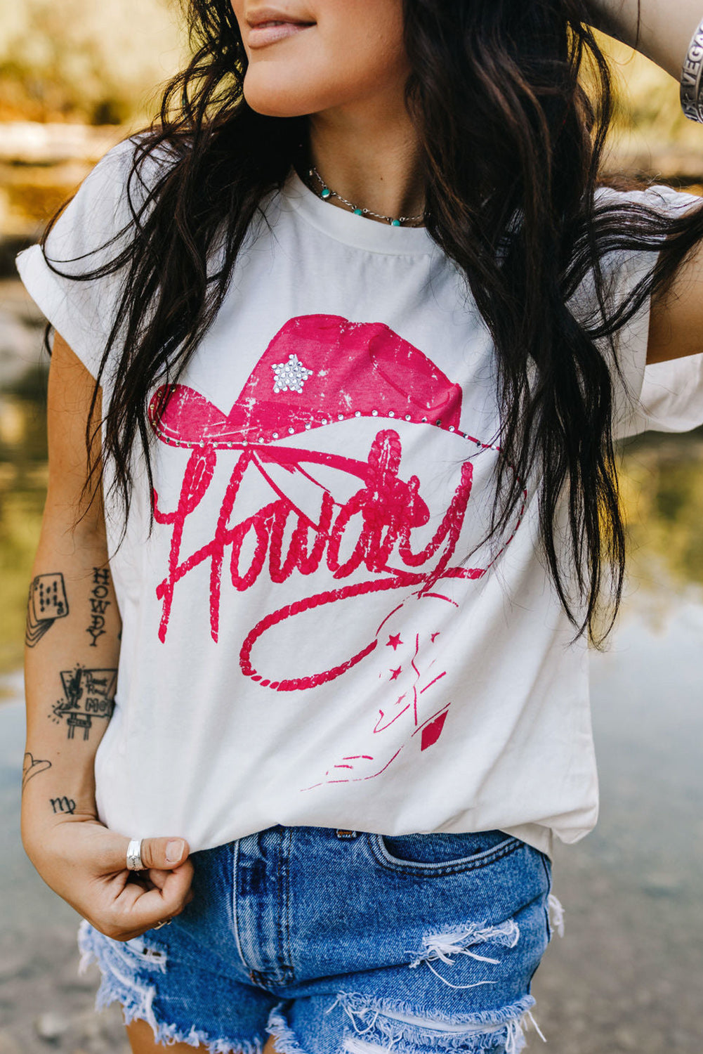 White rhinestone Howdy graphic tee close-up detail showing sparkling embellishments on cotton fabric – TeenStylo