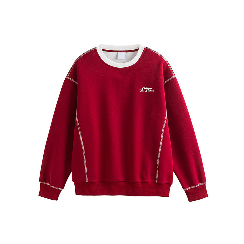Man wearing wine red embroidered sweatshirt styled in streetwear outfit | TeenStylo