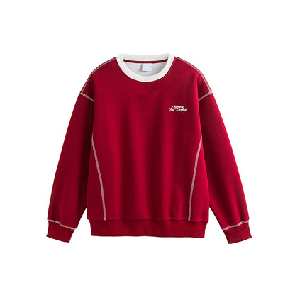 Man wearing wine red embroidered sweatshirt styled in streetwear outfit | TeenStylo