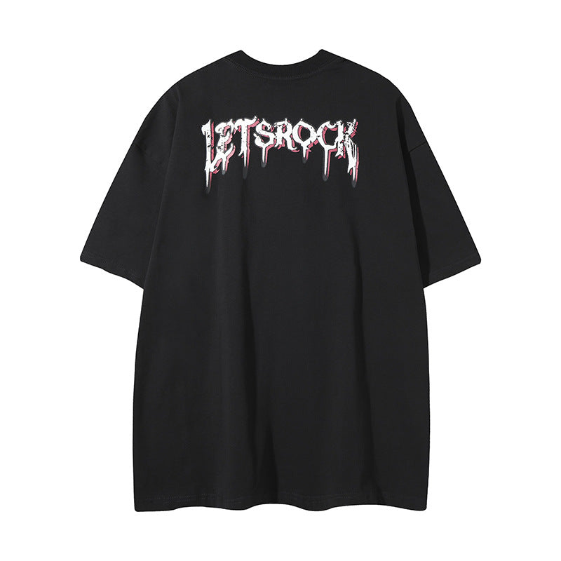 White streetwear t-shirt detail showing cartoon cat graffiti letter graphic print closeup - TeenStylo