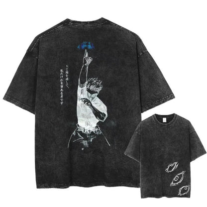 Person wearing vintage washed anime print cotton t-shirt in lifestyle setting, unisex streetwear style at TeenStylo