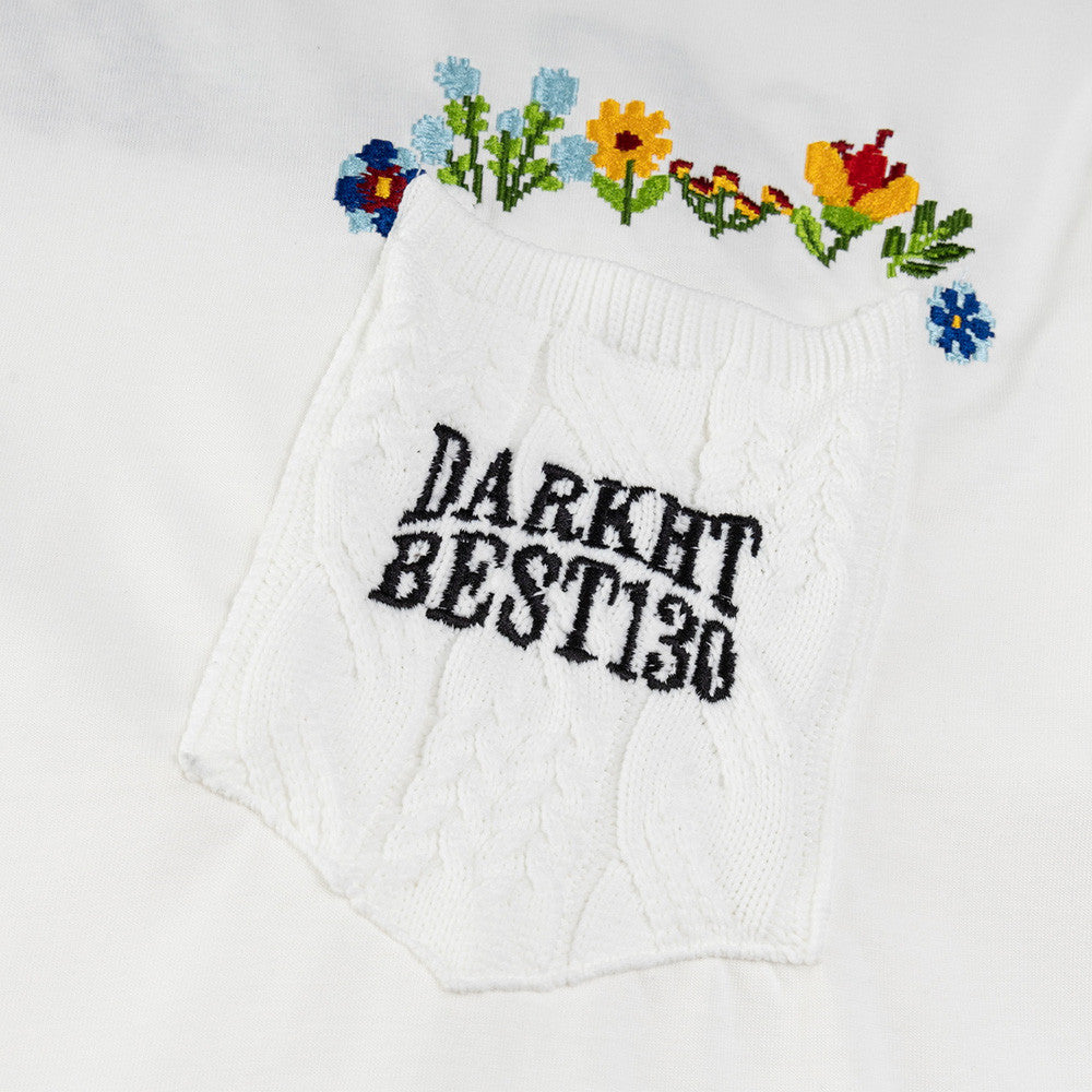 Black floral embroidery letter shorts styled in streetwear lifestyle look for teen guys | TeenStylo