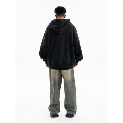 Black oversized patchwork hoodie worn as a streetwear lifestyle look, deconstructed gothic style for men | TeenStylo