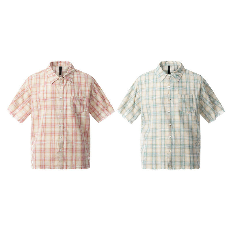 Close-up detail of green plaid frayed hem short sleeve unisex T-shirt texture and stitching - TeenStylo