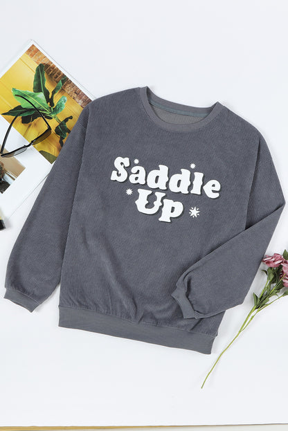 Gray unisex corded graphic sweatshirt with saddle-up print, Y2K streetwear style lifestyle shot | TeenStylo