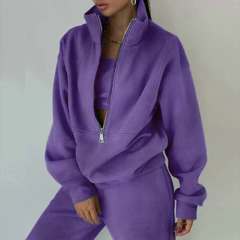 Black women's zipper hoodie tracksuit 2-piece set styled in streetwear lifestyle look | TeenStylo