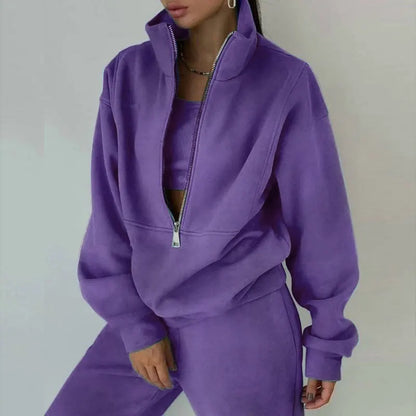 Black women's zipper hoodie tracksuit 2-piece set styled in streetwear lifestyle look | TeenStylo