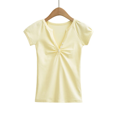 Yellow women's V-neck short sleeve T-shirt fabric detail close-up, Y2K streetwear style | TeenStylo