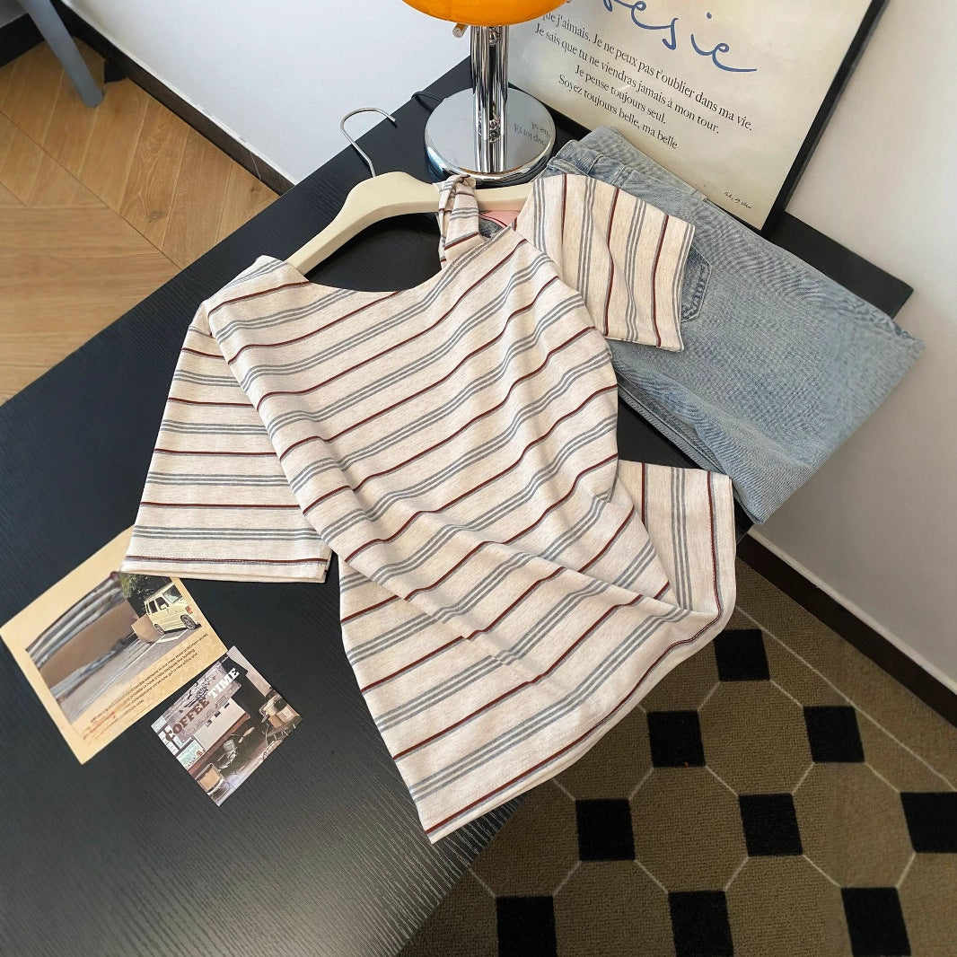 Stripe off-shoulder short sleeve T-shirt detail close-up, Y2K streetwear style for women | TeenStylo
