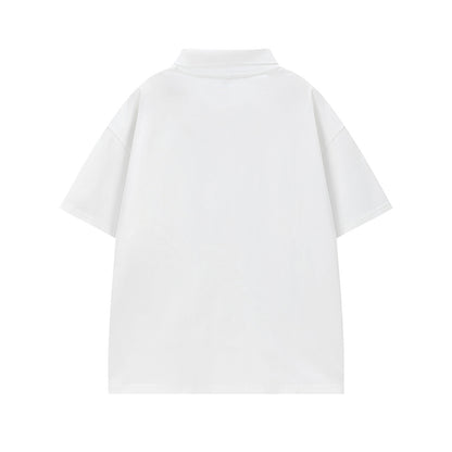 Close-up detail of white cartoon graffiti print on turn-down collar short, bold streetwear design | TeenStylo