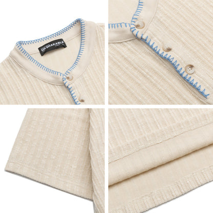 Man wearing apricot textured henley collar short sleeve t-shirt in casual streetwear style | TeenStylo