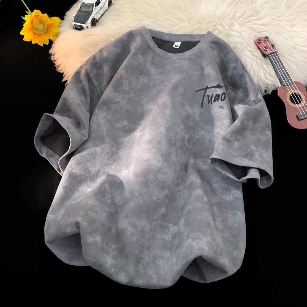 Black tie-dye short sleeve t-shirt close-up detail showing swirl pattern texture for men - TeenStylo