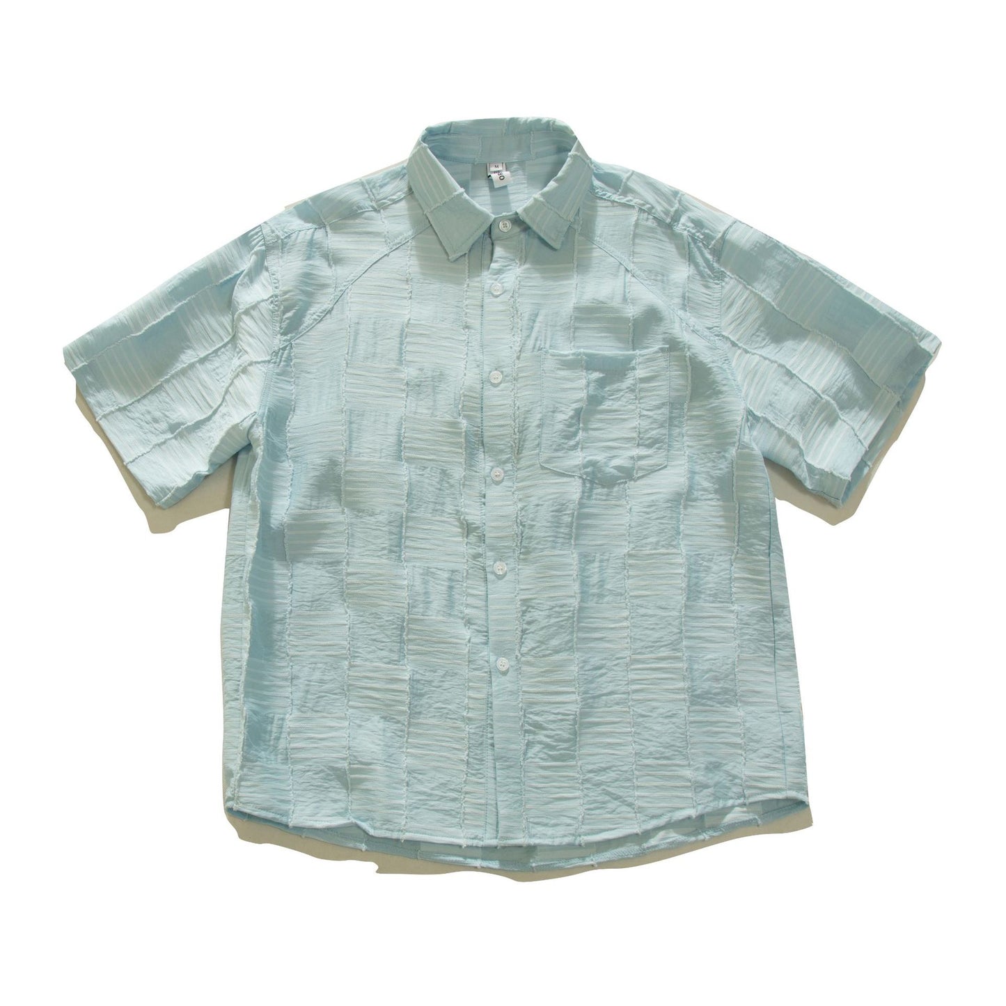 White men's loose short sleeve shirt fabric detail close-up | TeenStylo