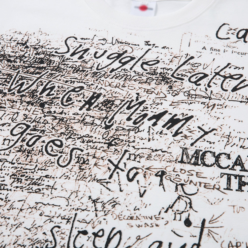 Male model wearing white heavyweight vintage graffiti loose short sleeve tee streetwear lifestyle shot TeenStylo