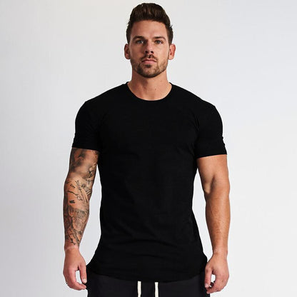 Black fitness t-shirt close-up detail showing plain fabric texture and fit for men by Muscleguys at TeenStylo