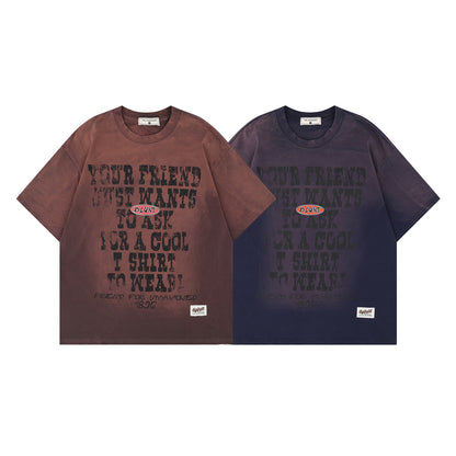 Man wearing brown retro letter graphic short sleeve t-shirt in urban lifestyle setting | TeenStylo