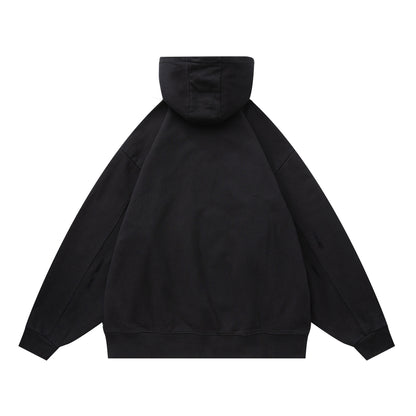 Black oversized hooded sweatshirt with patchwork design, unisex streetwear front view | TeenStylo