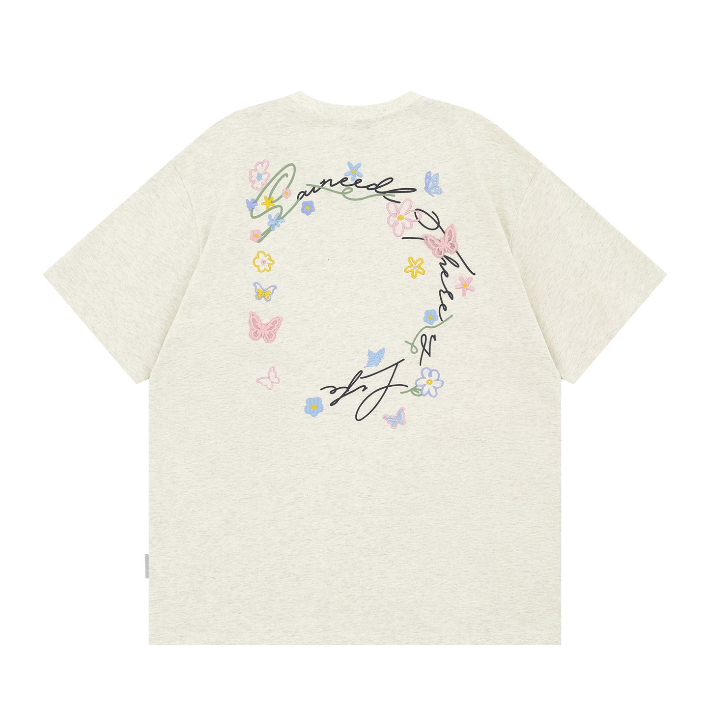 Black butterfly floral letter embroidery detail close-up on short sleeve tee - TeenStylo