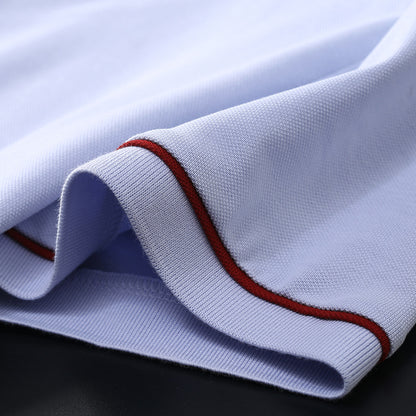 Man wearing light grey blue short sleeve polo shirt in streetwear lifestyle look | TeenStylo