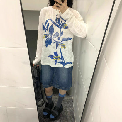 Retro long sleeve t-shirt styled in a lifestyle setting for women, streetwear aesthetic at TeenStylo