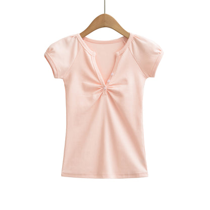 Pink V-neck short sleeve T-shirt styled in casual streetwear aesthetic for women and unisex fashion lovers | TeenStylo
