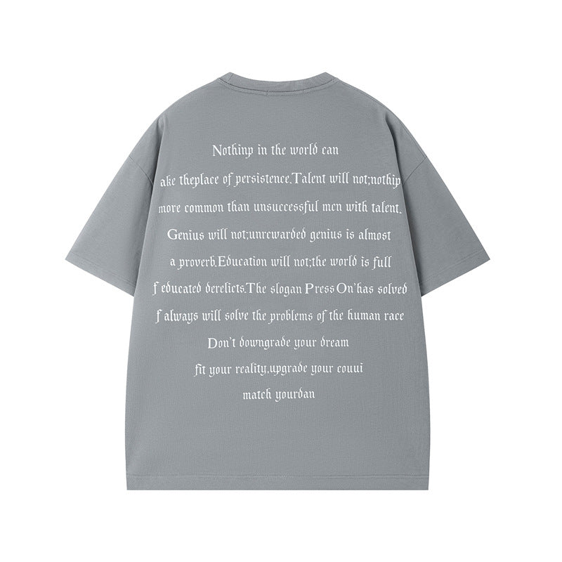 Man wearing black letter print heavyweight round neck t-shirt in streetwear style - TeenStylo