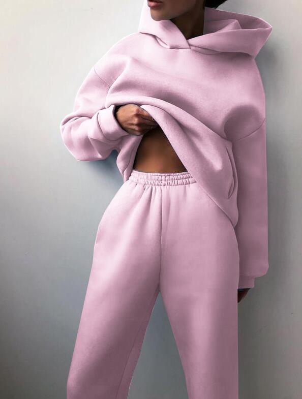 Pink women's tracksuit two-piece fleece sweatshirt set styled for autumn streetwear fashion at TeenStylo