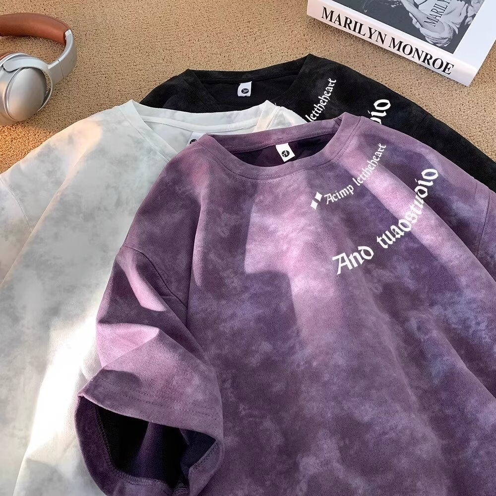 Man wearing purple tie-dye short sleeve t-shirt styled as casual streetwear outfit | TeenStylo
