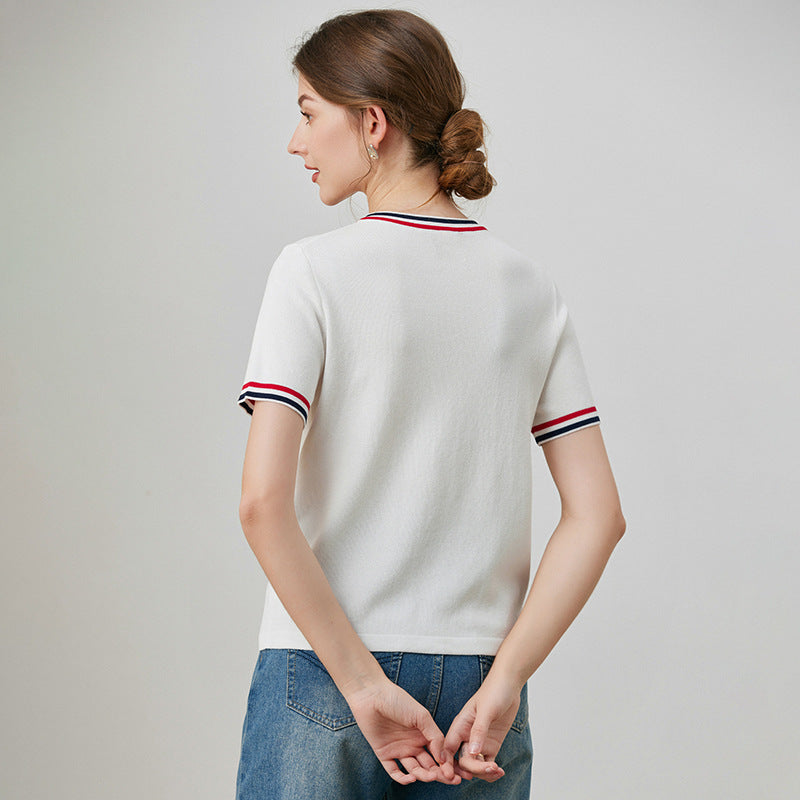 White loose embroidered short sleeve shirt lifestyle shot for women, Y2K streetwear style | TeenStylo