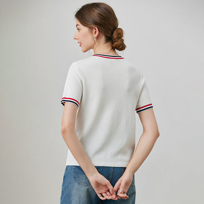 White loose embroidered short sleeve shirt lifestyle shot for women, Y2K streetwear style | TeenStylo