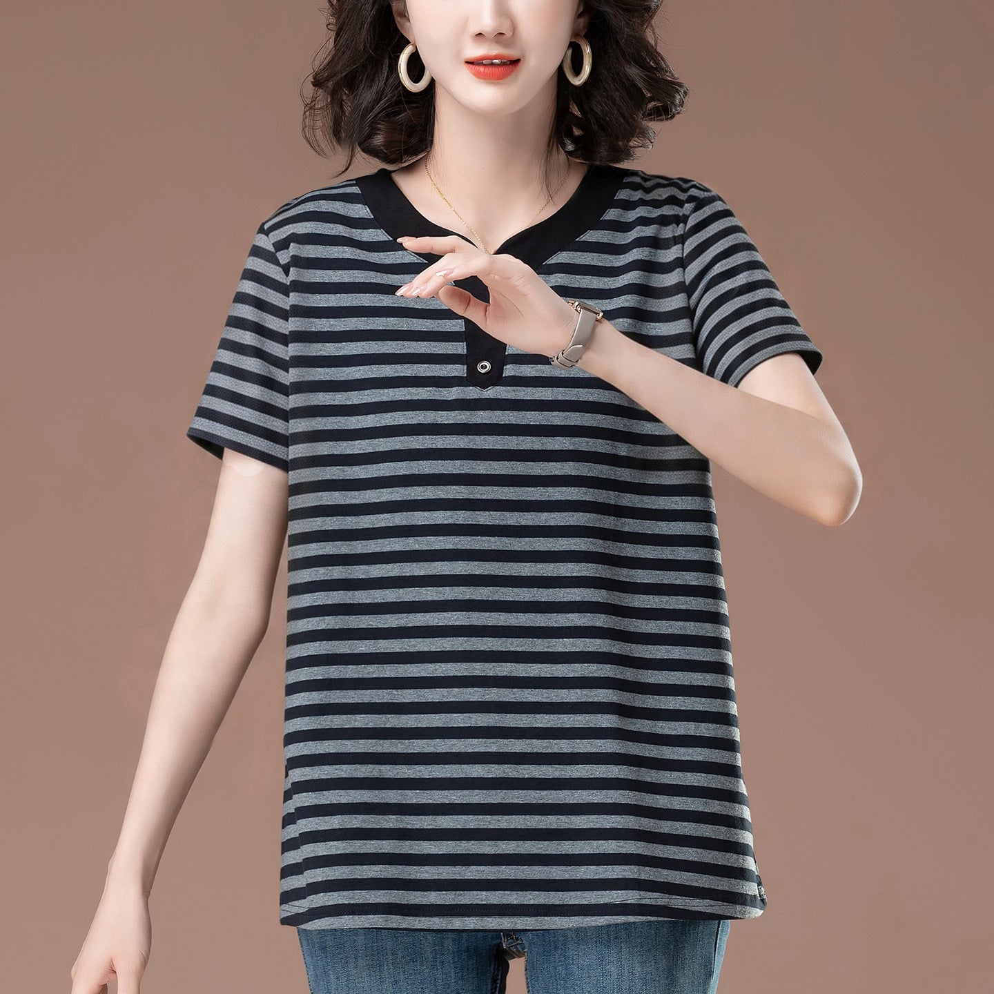 Close-up detail of women's floral gray striped short sleeve t-shirt fabric and stitching | TeenStylo
