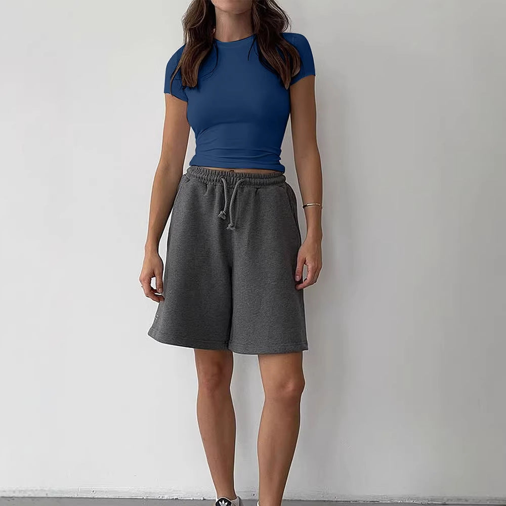 Blue slim fit short sleeve women's T-shirt styled in casual streetwear look, lifestyle photo | TeenStylo